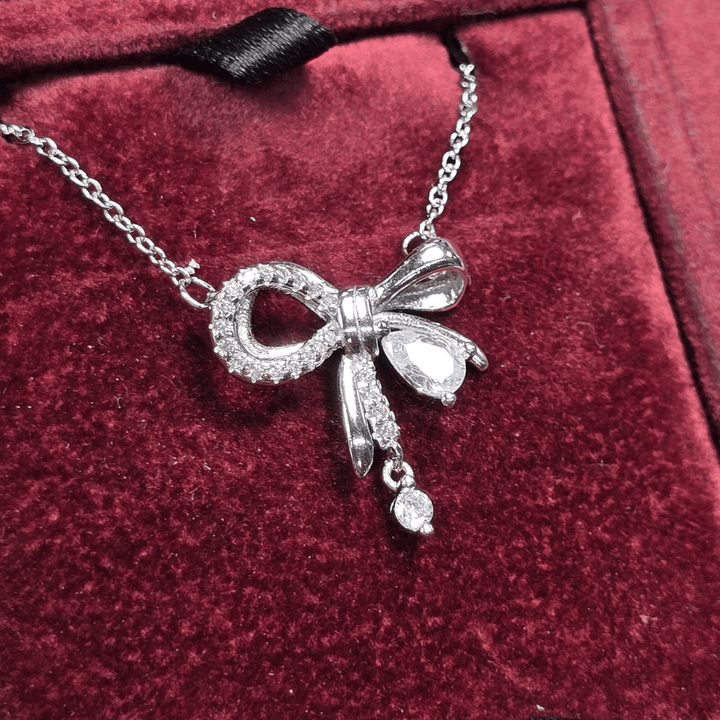 Graceful Glamour: Zircon Bow Pendant Necklace - Silver Signature - Necklace - Coastal Charm Creators