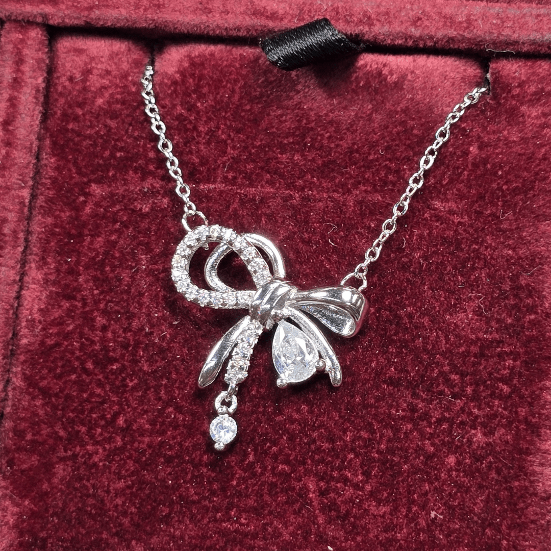 Graceful Glamour: Zircon Bow Pendant Necklace - Silver Signature - Necklace - Coastal Charm Creators